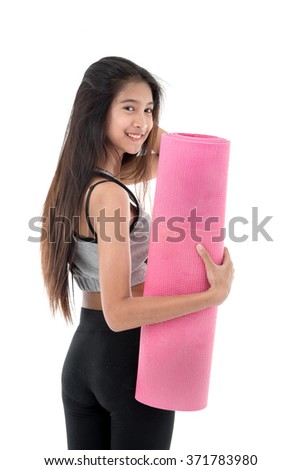 exercise fitness woman ready for workout standing holding yoga mat isolated on white background. Sporty fit and fresh Asian female fitness model.