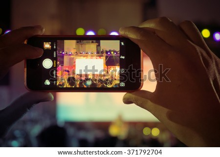 People use smartphone take picture at a concert, Crown of people enjoy