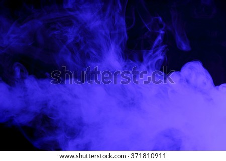 Abstract art. Blue smoke hookah on a black background. Inhalation. The steam generator. The concept of poison gas.