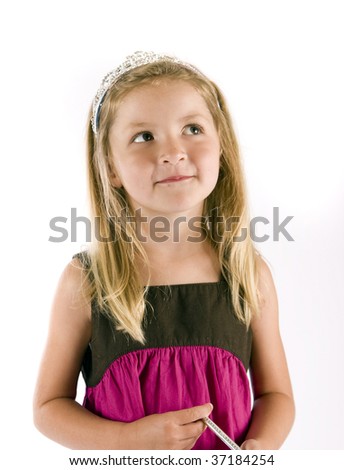 Cute little girl with a tiara and wand