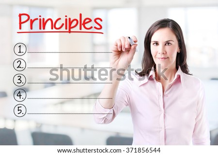 Business woman writing blank Principles list. Office background. 