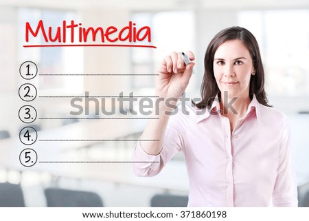 Business woman writing blank Multimedia list. Office background. 