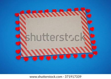 Envelope with hearts on blue background