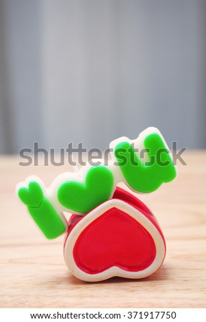 candles I love you and red heart isolated on wood 