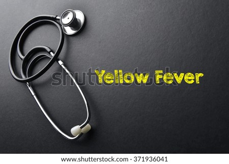 Yellow Fever word with stethoscope - health concept. Medical conceptual