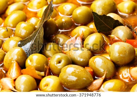 Marinated olives on a traditional craftsman market.Horizontal image. Royalty-Free Stock Photo #371948776