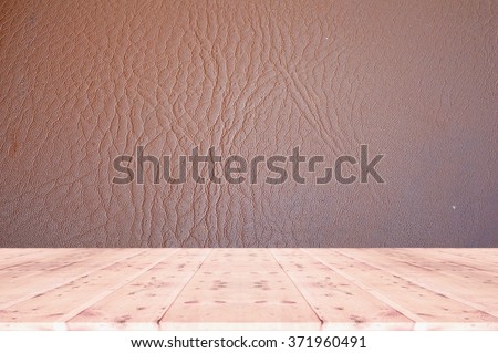 Wood table top on  leather  background- can be used for display or montage your products