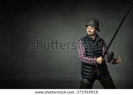 fisherman in a success gesture, dark background