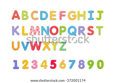 Colorful paper alphabet magnets on a whiteboard. Letters set isolated on white background