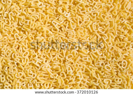 a lot of alphabet pasta Royalty-Free Stock Photo #372010126