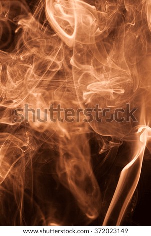 Movemet gold smoke on a black background.