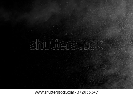 Abstract art. Grey smoke hookah and water drops on a black background. Inhalation. The steam generator. The concept of poison gas.