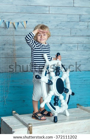 child holding a steering wheel