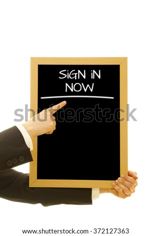 Hand showing Sign in Now word on a small blackboard