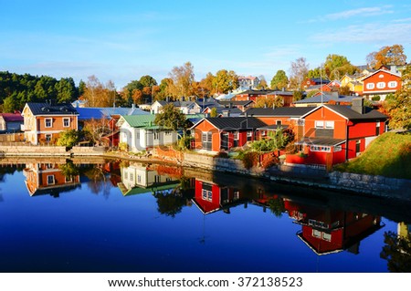 Reflection of colorful house in autumn, Porvoo, Finland Royalty-Free Stock Photo #372138523