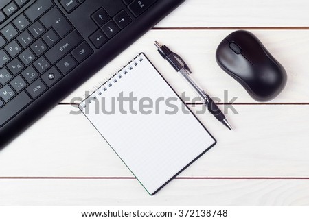 The keyboard and a mouse on a white table