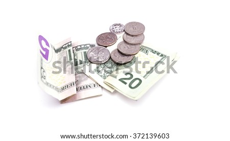 American dollar bills with coins isolated on white background. Pocket money
