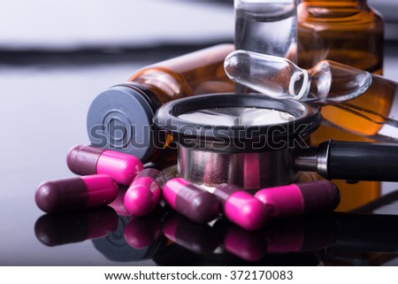 studio photo medical drugs to treat people in background