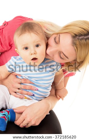 The mother hugs her child on a white background