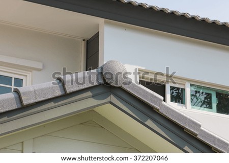 strong gray roof of house on sun light 
