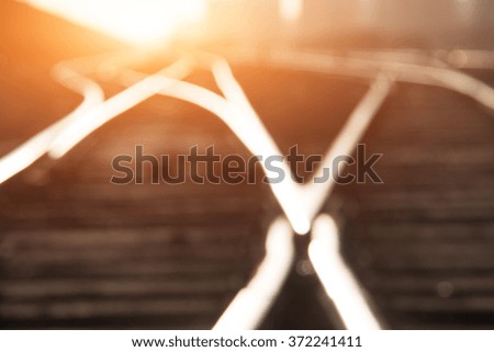 Railroad tracks at sunset, defocused background