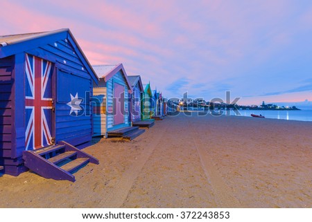 Beautiful Brighton bathing houses with rescue boat at sunrise, Melbourne, Australia Royalty-Free Stock Photo #372243853