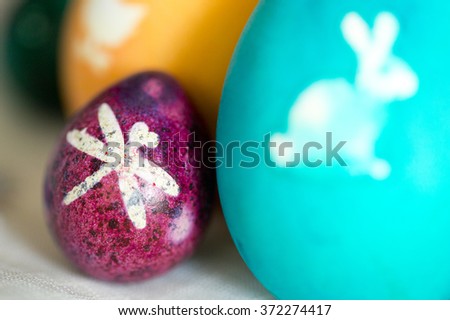 Colorful Easter eggs with white pictures
