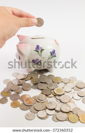 piggy bank Piggy isolated with a pile coins on the white background