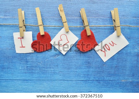 Valentine's Day.love concept, love confession.Happy valentine's day background with hearts hanging on rustic driftwood texture background,Love concept. 