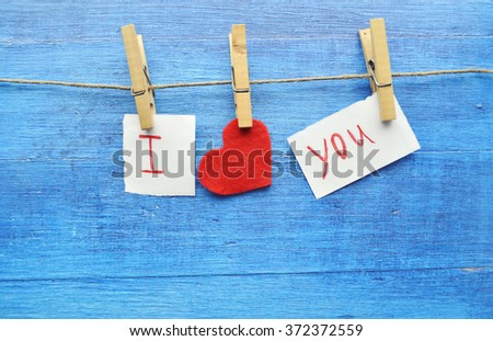 Valentine's Day.love concept, love confession.Happy valentine's day background with hearts hanging on rustic driftwood texture background,Love concept. 