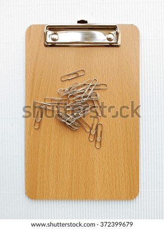 Writing board and  paper clip
