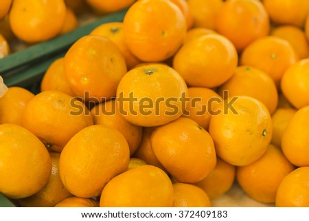 oranges fruit on market stall,with chinese new year background, in market,selective focus.
