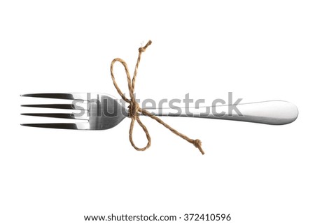 fork tied with string isolated on white background