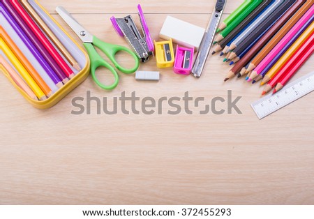 school supplies on wood table. Back to school.