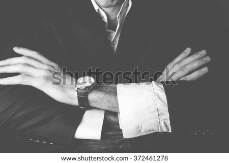 business man sitting cross arms