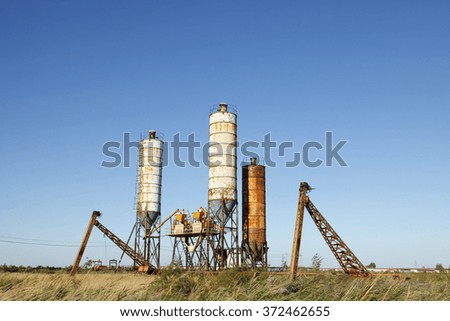 Concrete mixing tower. Concept of on-site construction facility.
