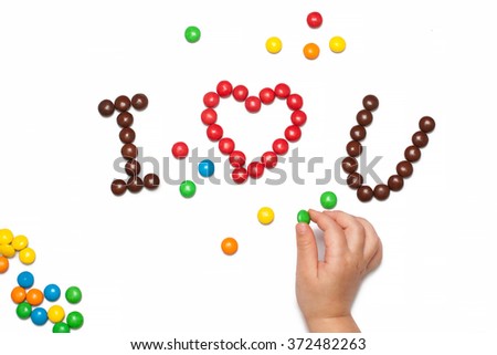 I LOVE YOU of the red and brown chocolate coated candy with children's hand