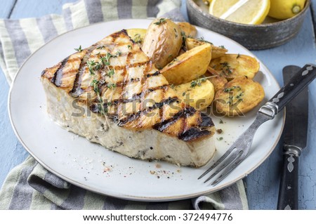 Barbecue Swordfish Steak on Plate Royalty-Free Stock Photo #372494776