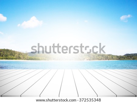 wood floor background blurred ocean beach abstract style.Light center of the image. Outdoors