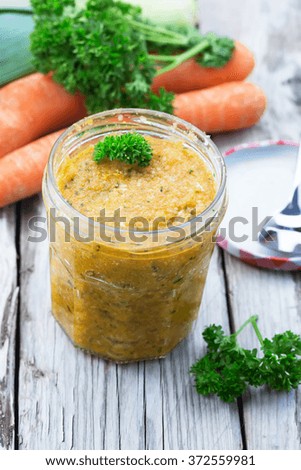 Homemade vegetable stock - with carrots, celery, leek and sea salt. Selective focus. 
