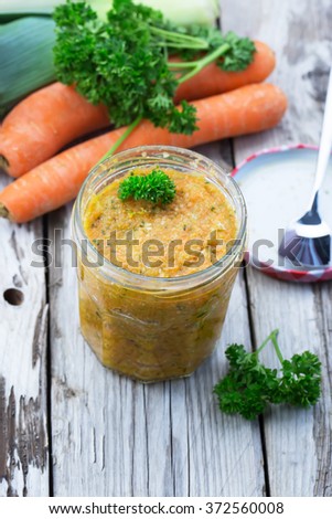 Homemade vegetable stock - with carrots, celery, leek and sea salt. Selective focus. 