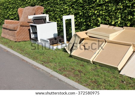 bulk garbage for collection at roadside Royalty-Free Stock Photo #372580975
