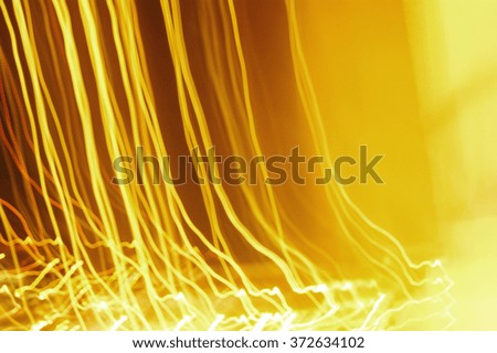 Dynamic night  lights on yellow orange background. Abstract