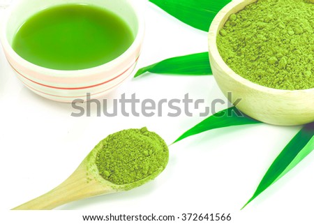 Matcha Tea in the wooden bowl  isolated on white background