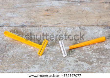 used razor blade on the wood table