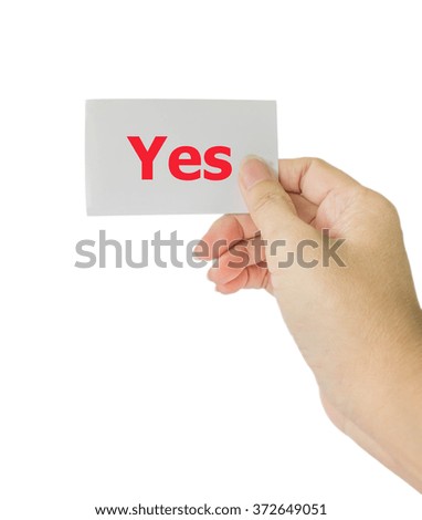 concept photo of right hand hold paper with word yes isolated on white background