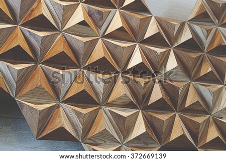 abstract  tetrahedron made out of wood pyramids. 