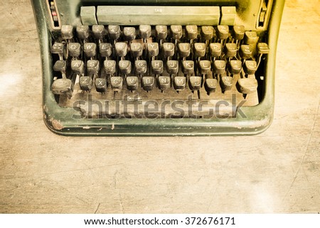 Typewriter antique vintage style on a old wood table