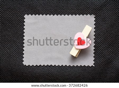 Love conceptual background with wood clips,love shape on grey paper