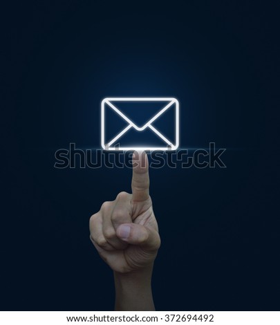 Man hand pushing email icon touchscreen over blue background